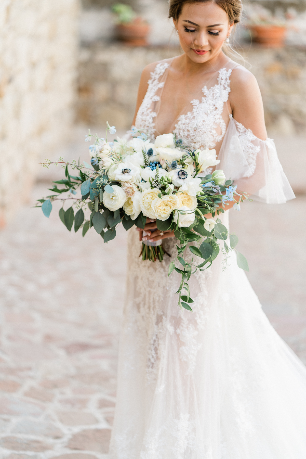 Bride with cascading fine-art bouquet