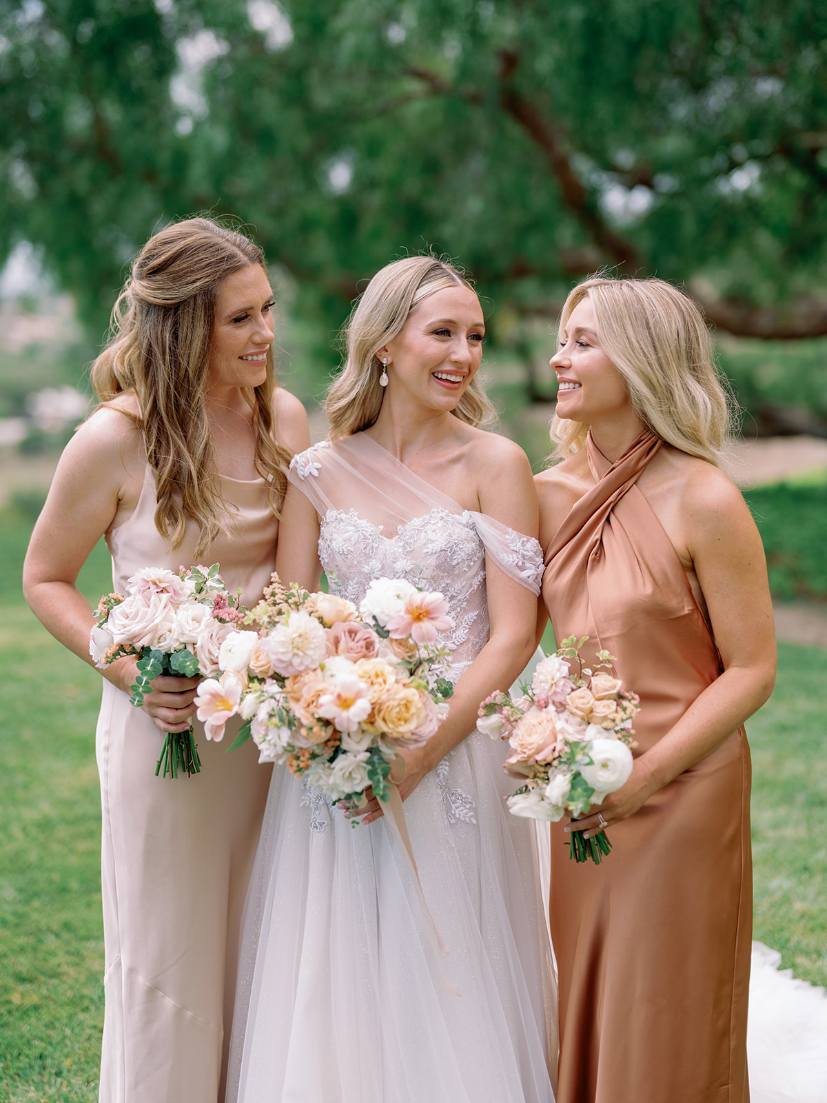 Bridesmaids with blush bouquets